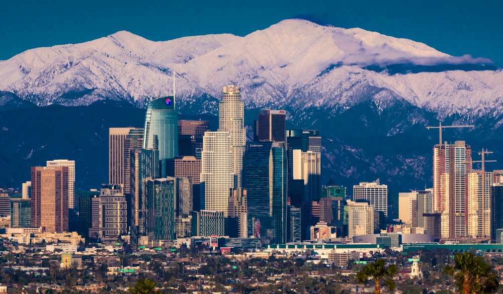 Los Angeles Skyline framed by San Bernadino Mountains and Mount Baldy with fresh snow 