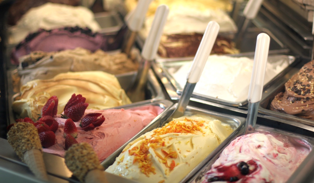 Close-up of several flavors of gelato in a store window