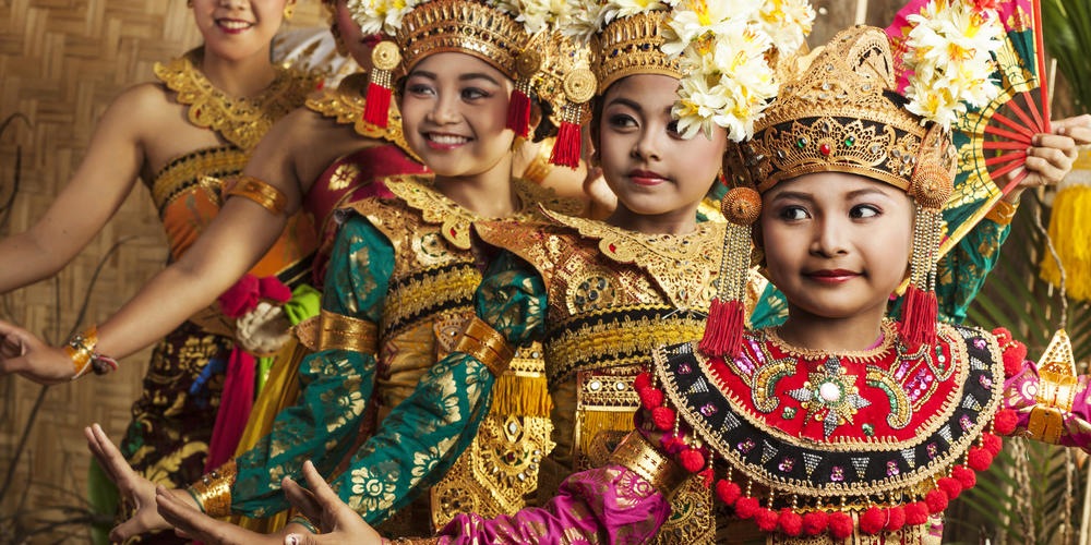 Row of traditional Balinese dancers in costume