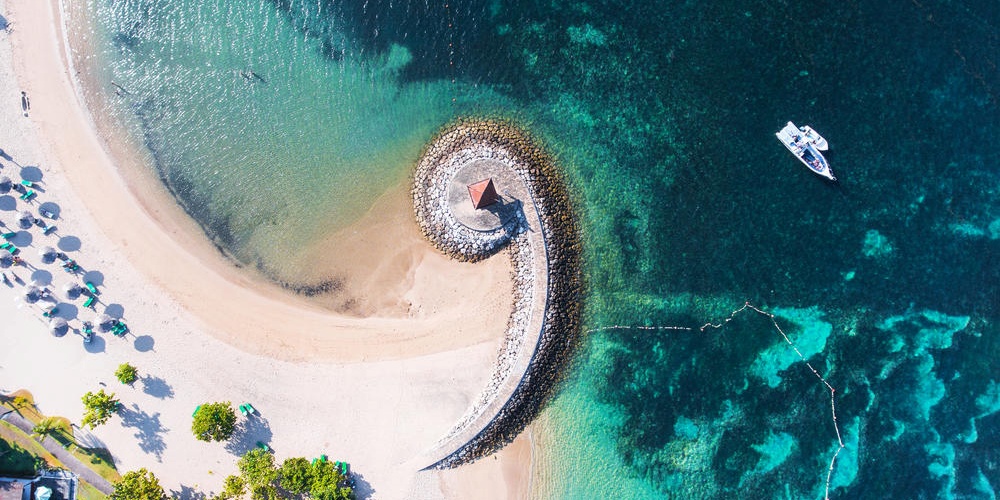 Bali Nusa Dua coast with a figurative breakwater aerial view