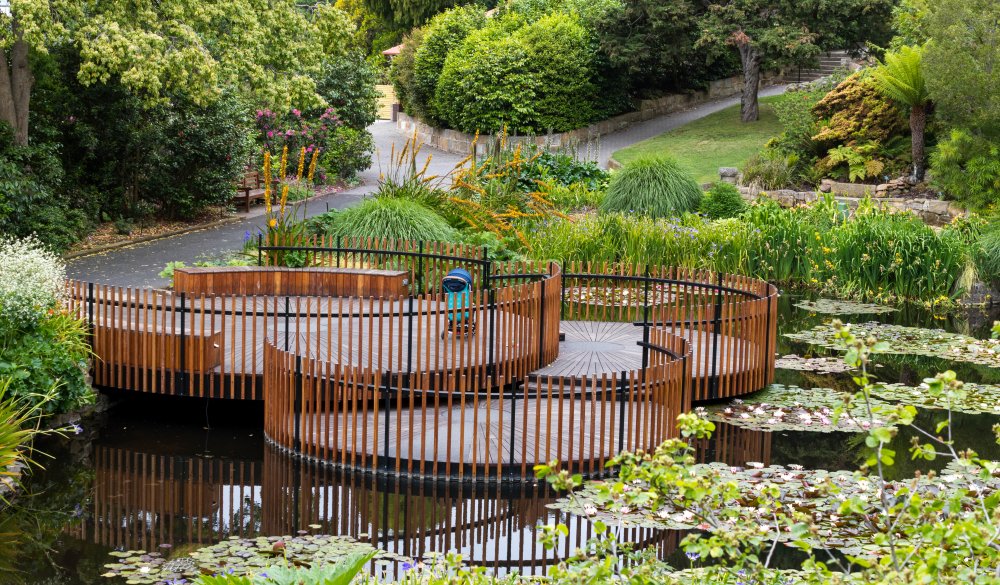 Pond at Royal Botanical Garden. Picture is taken in Royal Botanical Garden. Hobart, Tasmania, Australia. There is a pram parked as well.