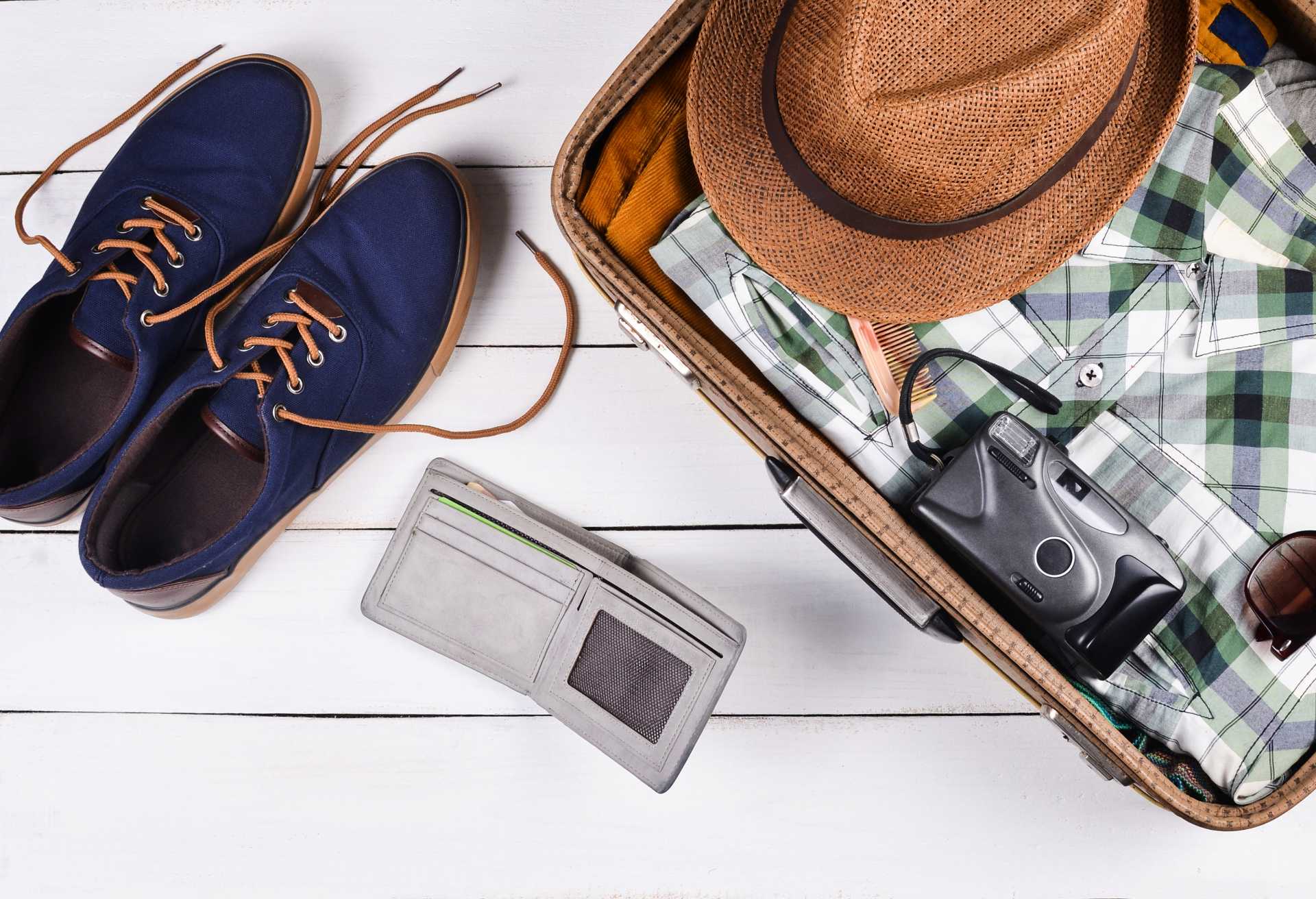 Open suitcase for travel with things and accessories