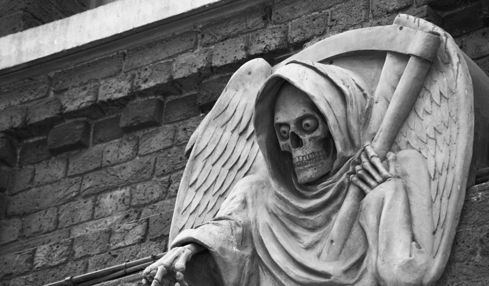 photo of a death statue outside the London Dungeon, UK; Shutterstock ID 155612117