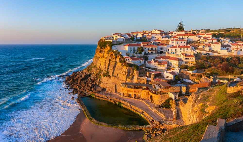 Typical village Azenhas do Mar on top of oceanic cliffs at sunset, Portugal; Shutterstock ID 1416774074