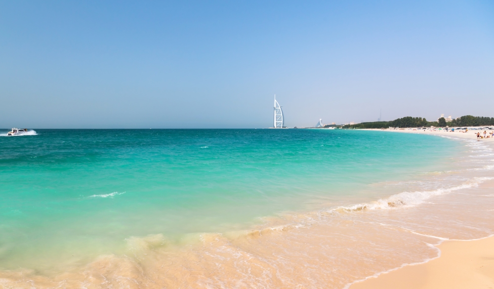 Public beach with turquoise water in Dubai,