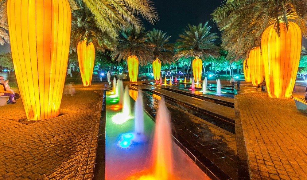 Orange carrot palm trees. Newly opened Dubai Glow Garden day to night transition timelapse is a state of Art architecture featuring environment friendly architecture, creating various structures from; Shutterstock ID 779376484