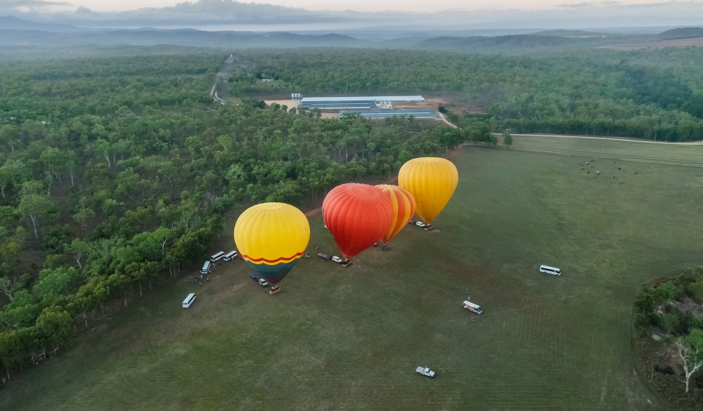 Aerial images of hot-air balloons taking off ; Shutterstock ID 1698659560
