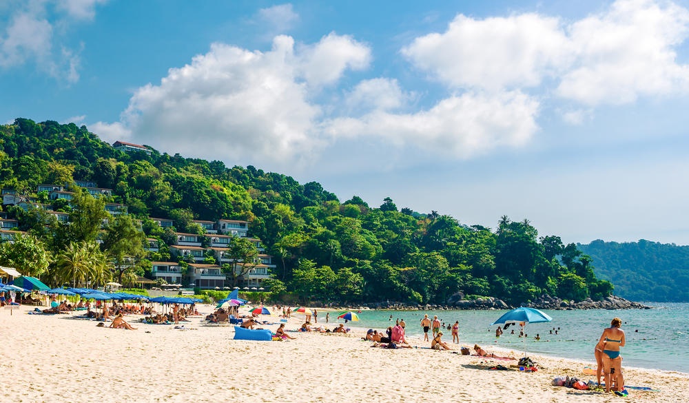 Tourists on the Kata Noi beach - one of the best beaches in Phuket, Thailand ; Shutterstock ID 634215416; Purpose: BEACHES; Brand (KAYAK, Momondo, Any): KAYAK