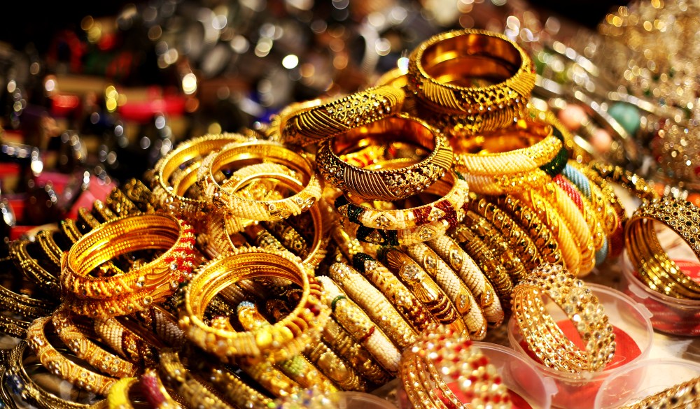 Bracelets and bangles in a row in street market in Dubai