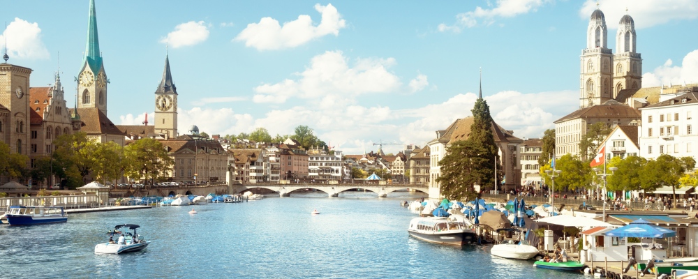 Zurich city center with famous Fraumunster, Grossmunster and St. Peter and river Limmat, Switzerland; Shutterstock ID 735678397