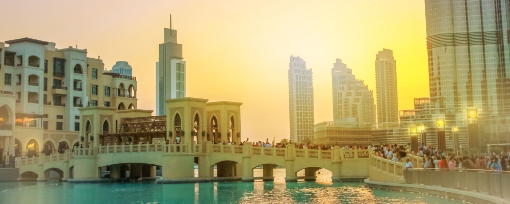 the Souk Al Bahar and Burj Khalifa at dusk in Dubai Downtown District,