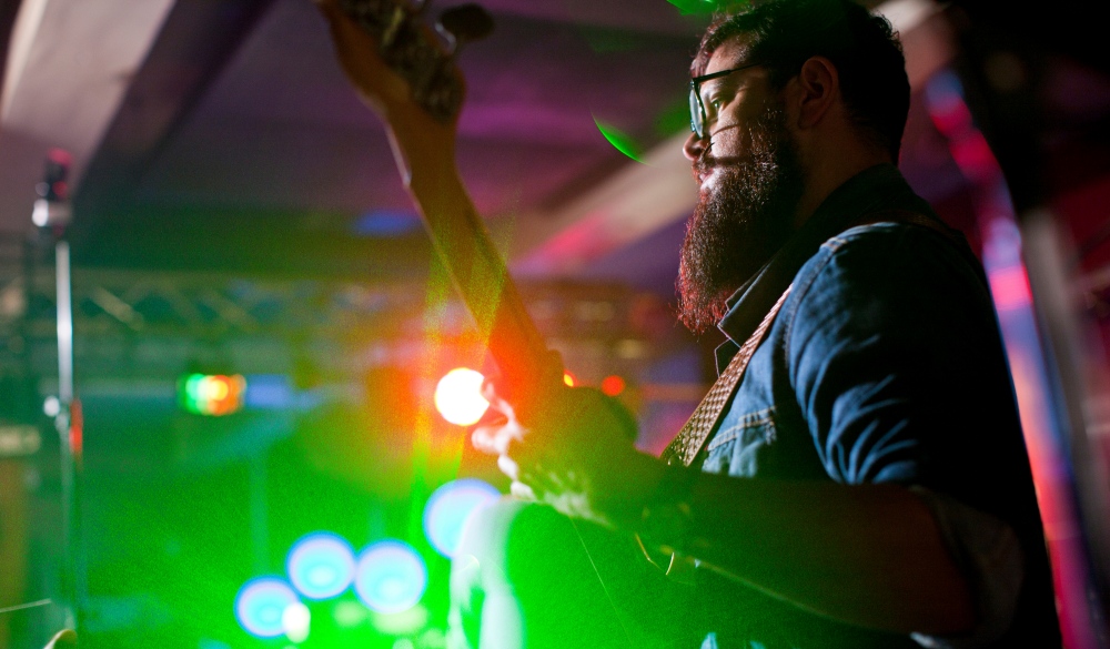 Man playing guitar in nightclub, Quezon City nightlife spots