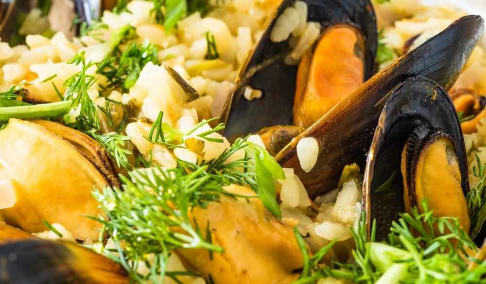 Lemon rice with mussels, midopilafo close up, macro - greek dish