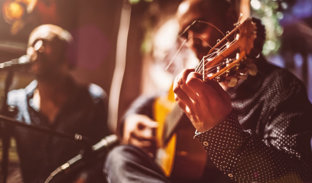 Two male musicians on a stage performing, Quezon City nightlife spots