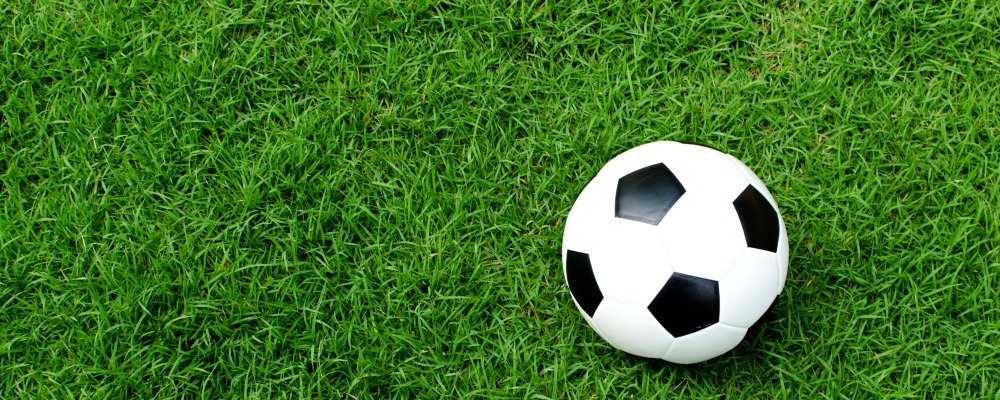 Soccer ball on green field