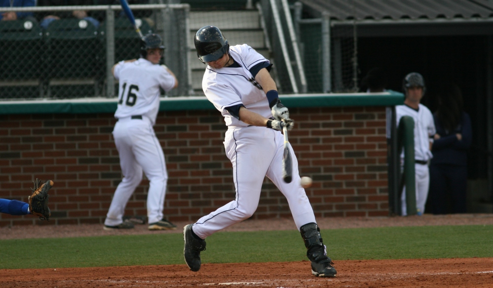 a man hitting a ball