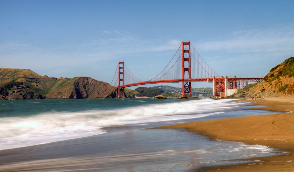 Baker beach with Golden Gate Bridge from afar