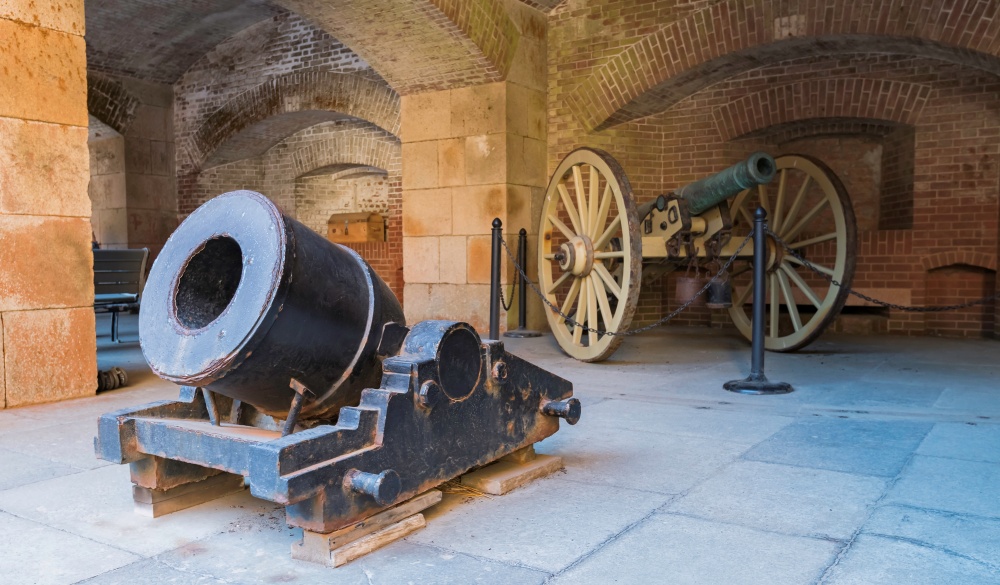 Two old cannon in Fort Point building