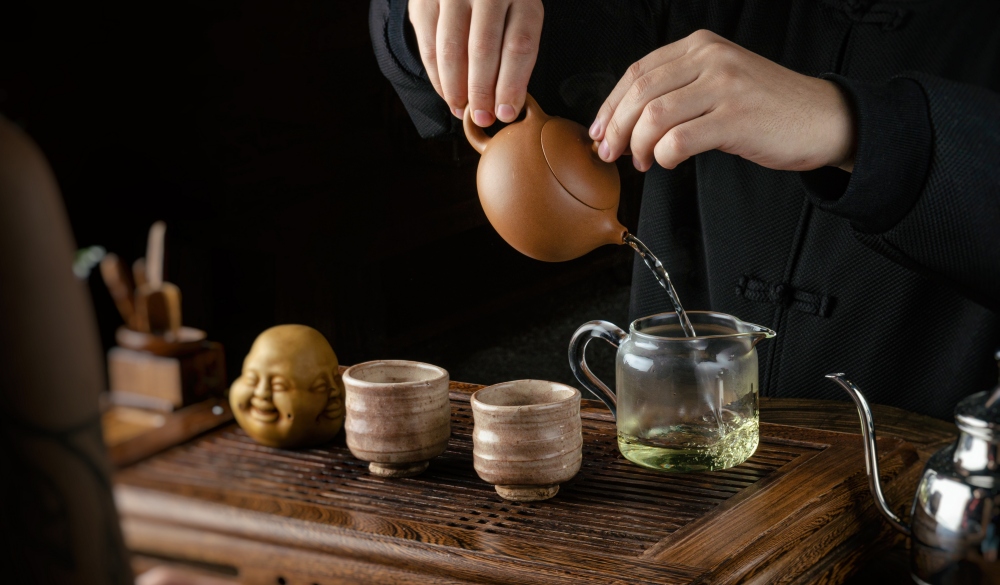 tea ceremony hand men and women to pour the tea; Shutterstock ID 1518870629