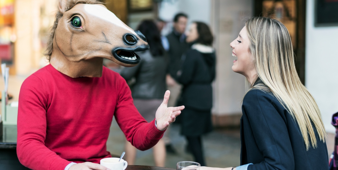 Woman and horse face man drinking coffee