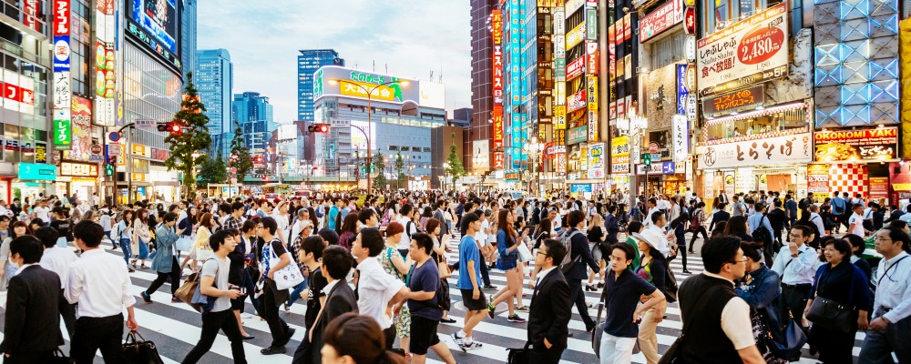 Zebra crossing in Shinjuku, Tokyo at sunset.