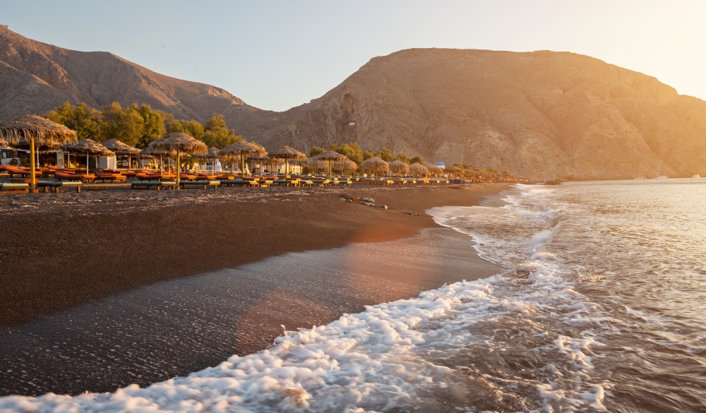 Perissa beach during sunrise on the Greek island of Santorini 