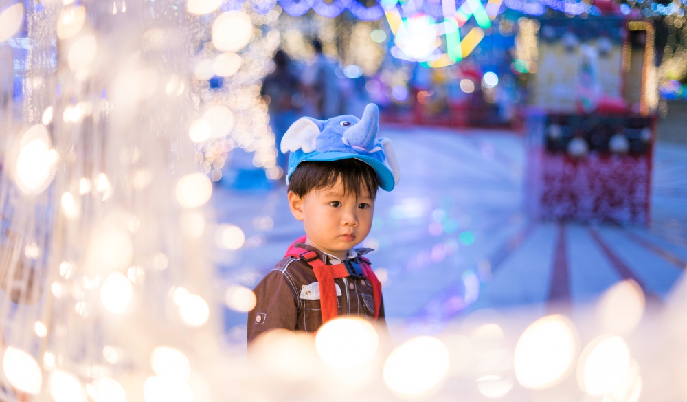 Boy Looking Away In Amusement Park, Thailand, Asia