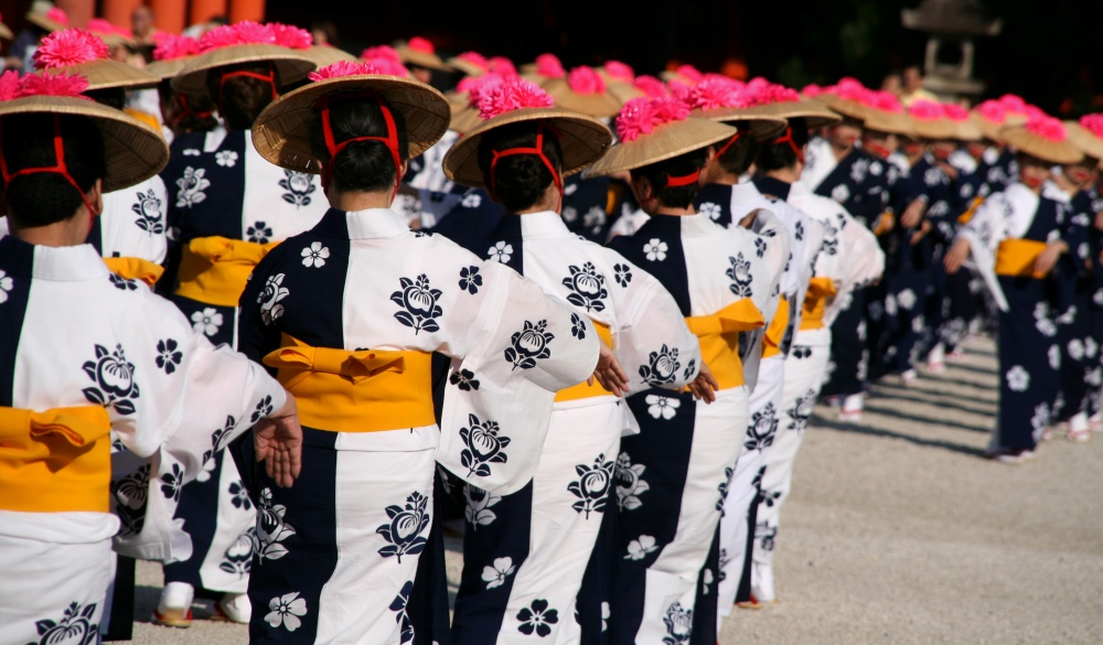 Dancers dressed in traditional Kimono performing ritual dance at Heien Shrine, Kyoto, Japan.