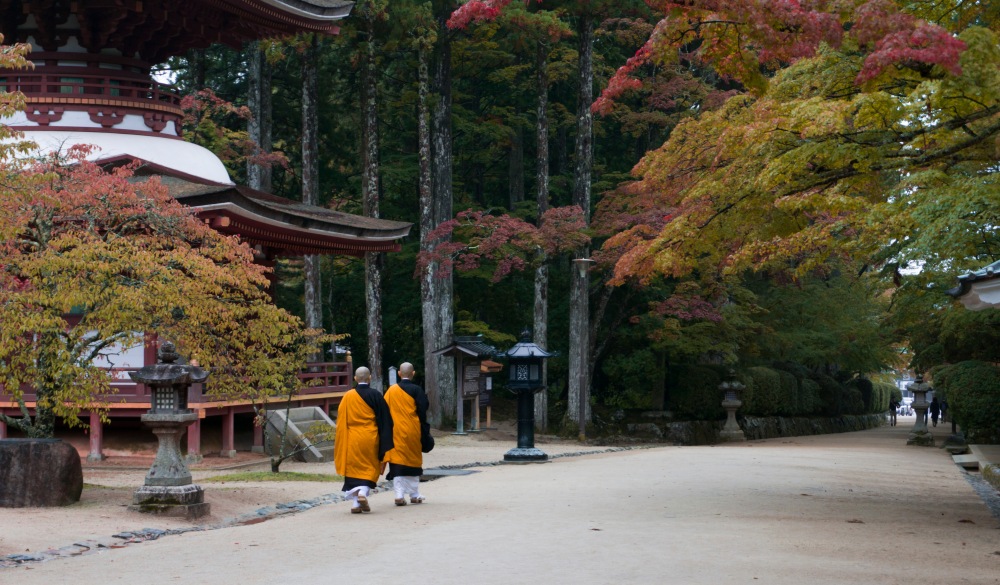 Buddhist monks walking past temple in Koyasan, Mt Koya, Japan during autumn. ; Shutterstock ID 793549504