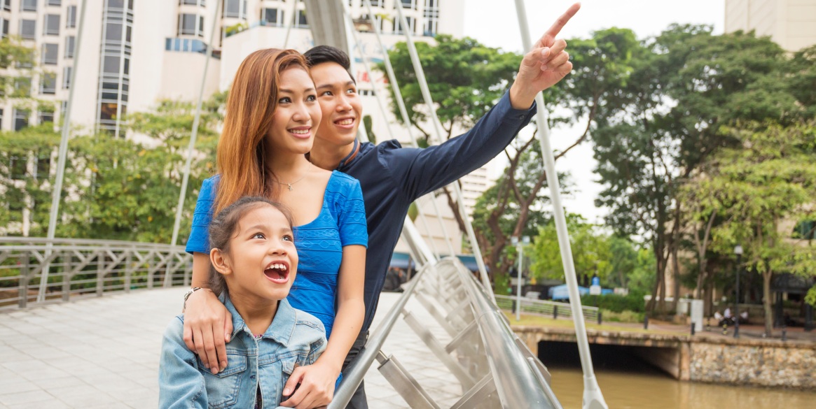 Asian family sightseeing on a bridge in Singapore