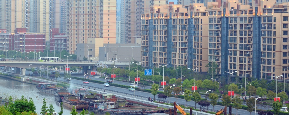 Suzhou Creek (or Wusong River) is a river that passes through the Shanghai. View at barges and Changning Road.