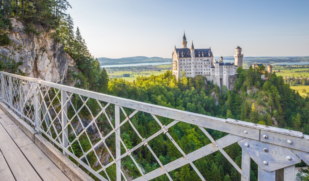 Beautiful view of world-famous Neuschwanstein Castle, the 19th century Romanesque Revival palace built for King Ludwig II, in evening light at sunset seen from Marienbrucke, Allgau, Bavaria, Germany; Shutterstock ID 465693332