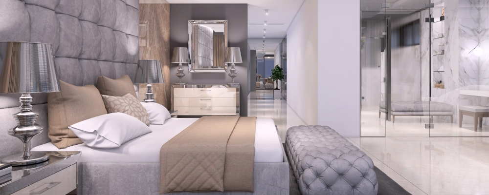 Luxury hotel like bedroom interior with large bed, seat, and terrace. expensive marble wall and large bathroom with glass wall. copy space render