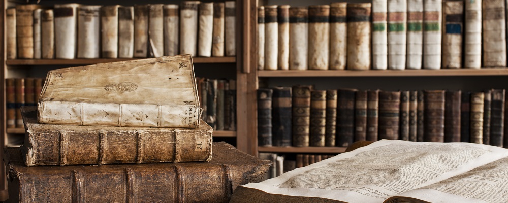 400 year old antique books in a library. 
