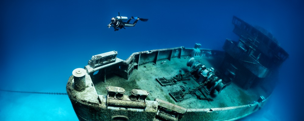 The ex-USS Kittiwake was a Submarine Rescue vessel (ASR-13). She was part of the 6th Submarine squadron (SUBRON 6) home ported at the Destroyer-Submarine piers in Norfolk, VA. The location for sinking the Kittiwake is at the northern end of Seven Mile Beach, on the West or lee side of Grand Cayman.