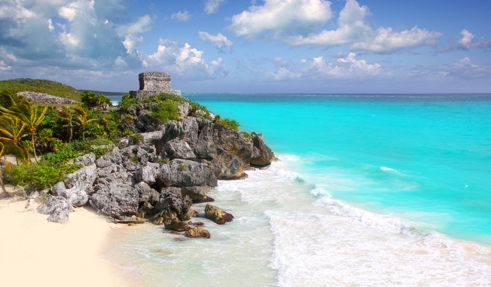 ancient Mayan ruins temple of Tulum in Caribbean turquoise sea shore