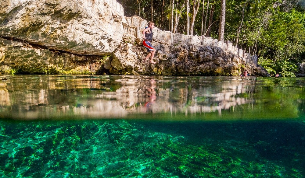 Riviera Maya Kid friendly, boy Jumping In Tortuga Cenote