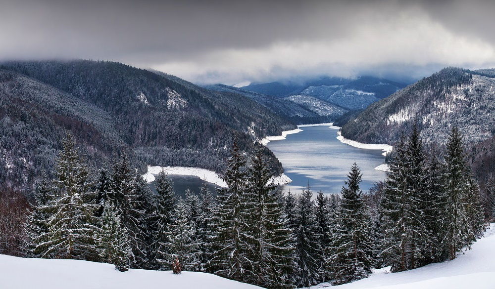 lake and snowy mountains in Romania