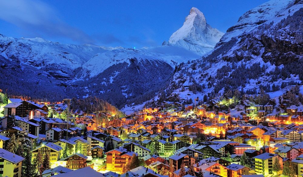 Switzerland village surrounded by snowy mountains