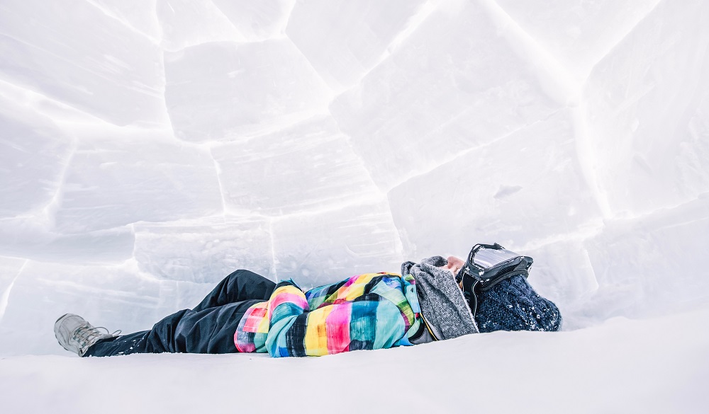 Woman Lying In Igloo hotel