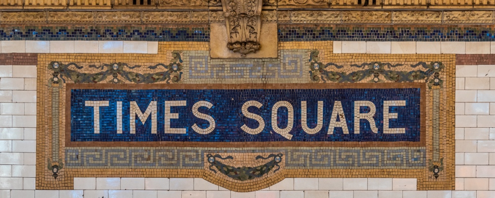 A ceramic mosaic sign on the NYC subway system at the Times Square station