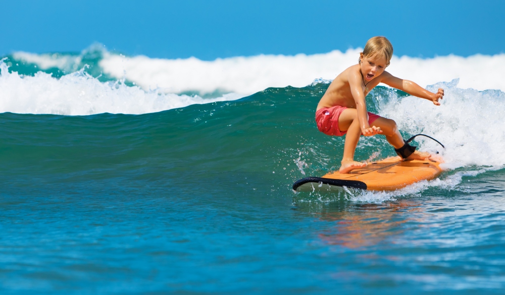 Young Surfer on Surfboard