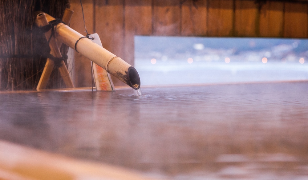 Water flows at a japanese open air hot spring (onsen); Shutterstock ID 280304819