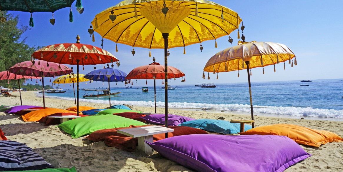 beach umbreallas and pillows on a tropical beach, spa hotels near kuta