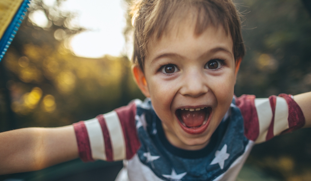 Portrait of cute, smiling, little boy celebrating Fourth of July