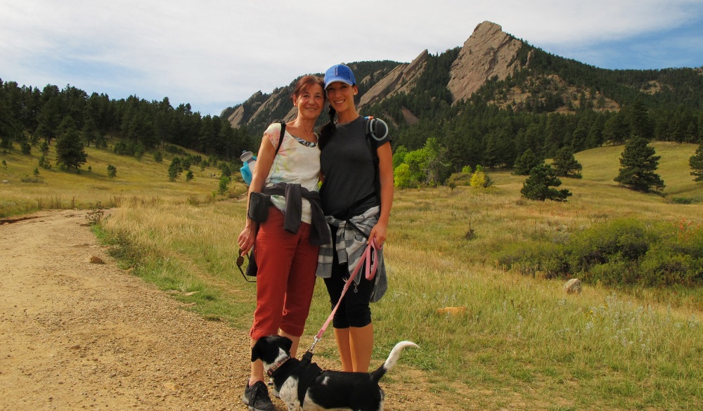 Two women with dog during hike, mother's day getaway