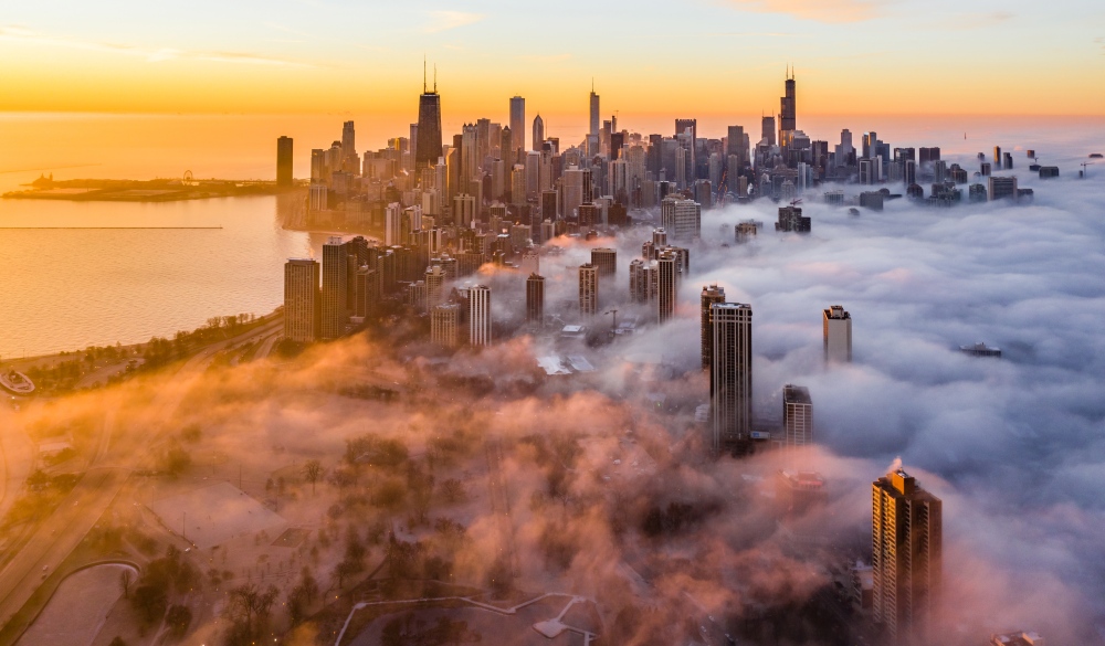 Aerial View Of Buildings And Lake Michigan Against Sky During Sunrise
