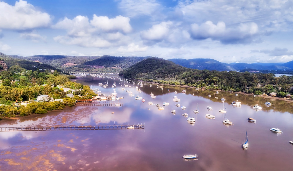 Small aquaculture fishing village on Hawkesbury river in Australia near Sydney - still waters with marina and oyster farms.