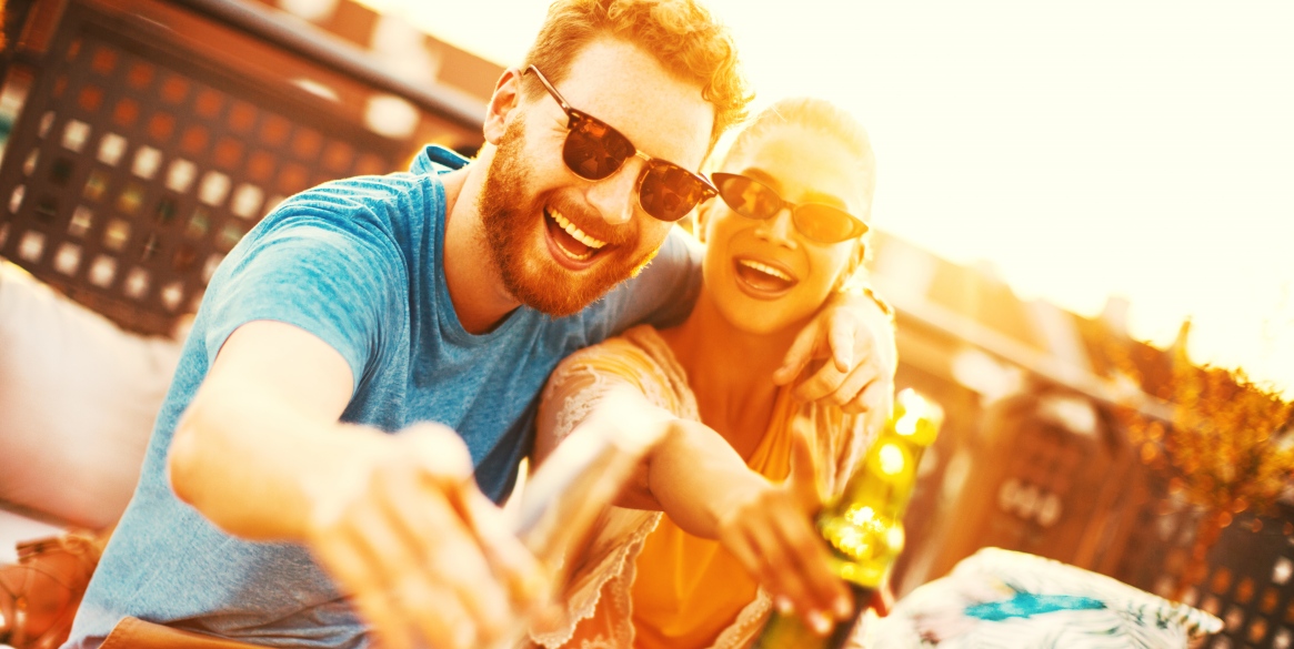 Young couple enjoying at rooftop party