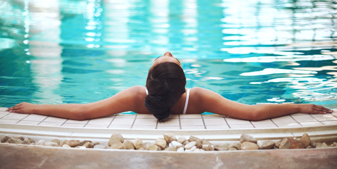 young woman relaxing in the pool